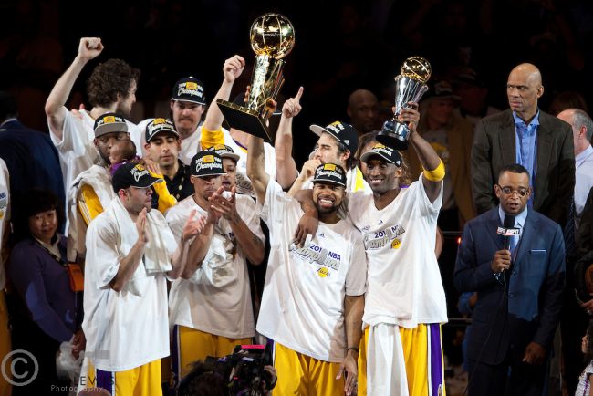 17 June 2010: Guard Derek Fisher of Los Angeles Lakers holds up the Larry O'Brien NBA Championship Trophy as Kobe Bryant holds up the Bill Russell Finals MVP Trophy as teammates celebrate after the Lakers defeat the Boston Celtics 83-79 and win the NBA championship in Game 7 of the NBA Finals at the STAPLES Center in Los Angeles, CA.